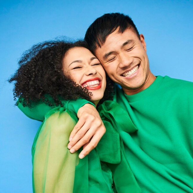 Happy couple in green outfits