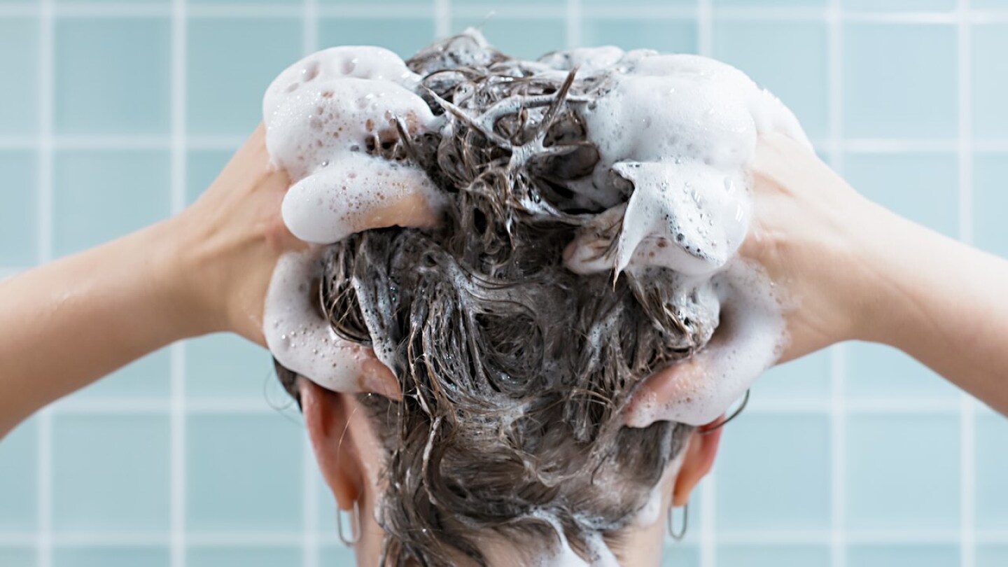 Woman shampooing her hair